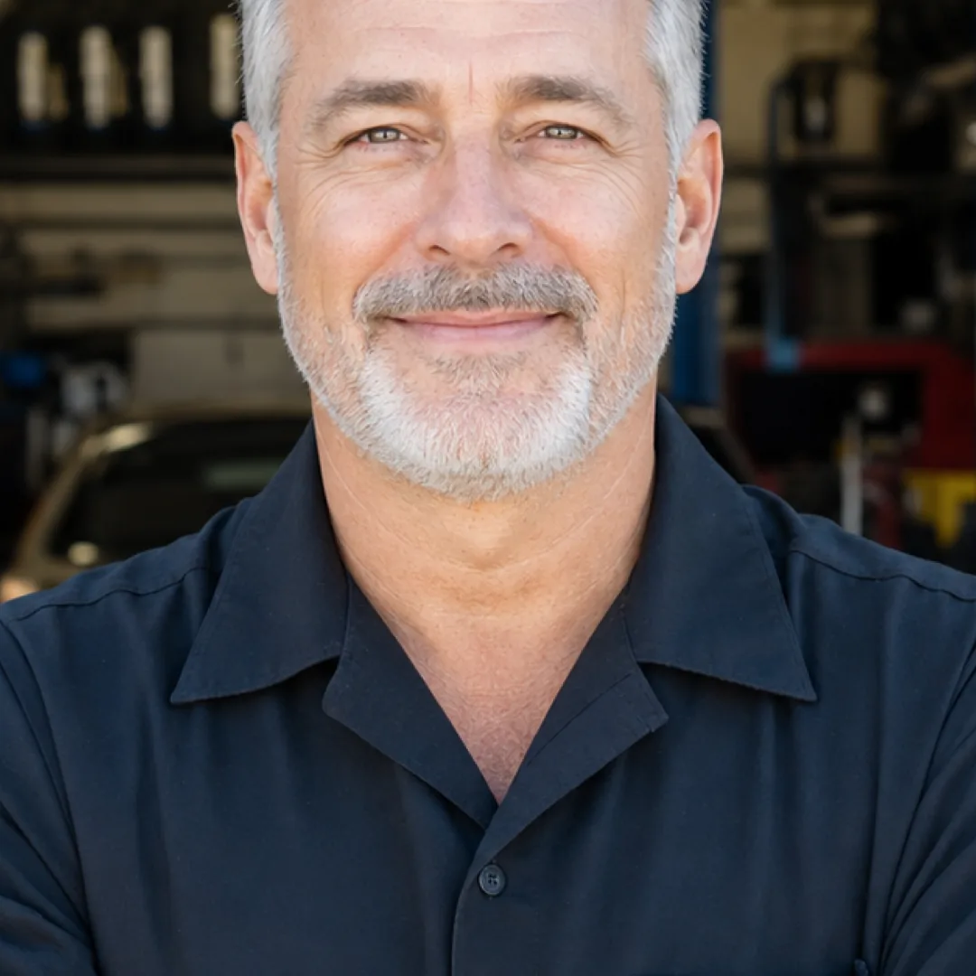 An independent Big O Tires store owner outside their shop